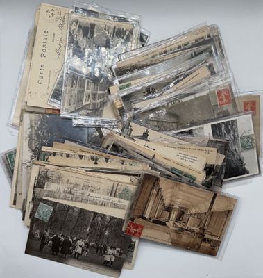 a pile of old postcards sitting on a table