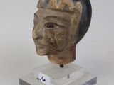 an image of a statue of a man ' s head on a clear base