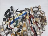 many different types of watches on a white surface