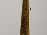 a gold vase that is sitting on a table