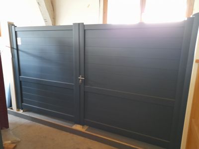 a picture of a garage with a blue gate
