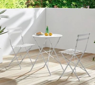 two chairs and a table on the deck