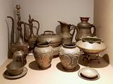 many different types of vases on display in this room