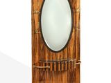 a wooden clock with a mirror on top of it