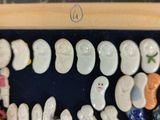 a picture of a collection of ceramic figurines in a display case