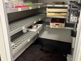 a pantry with shelves and bins of food inside of it