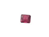 a close up of a pink diamond on a white background