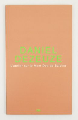 a book with a green logo on the cover of it