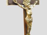 a cross with a crucifid on it on a table