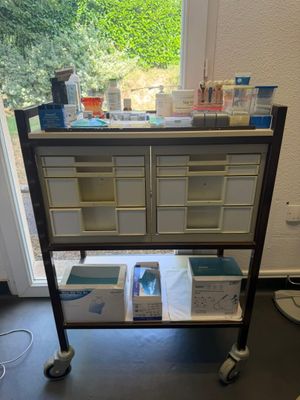 an image of a cart with a lot of supplies on it