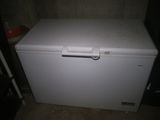 a small white chest freezer sitting in a room