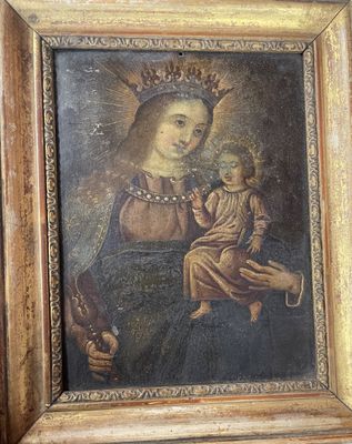 an old painting of a woman holding a child in her lap
