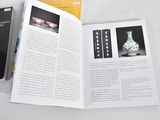 a book opened to show a picture of a vase and a book