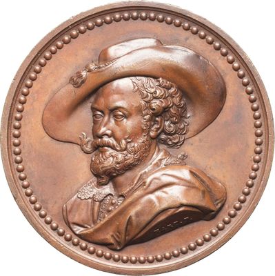 une image représentant un médaillon en bronze sur lequel figure un homme coiffé d'un chapeau