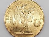 a close up of a gold coin on a white surface