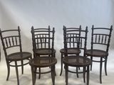 six chairs are lined up in a row on a white background