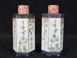 pair of chinese porcelain vases with flowers and birds on them