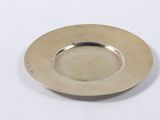 an image of a silver plate sitting on top of a white table