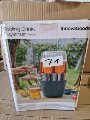 packaging of a beverage dispenser sitting on top of a cardboard box