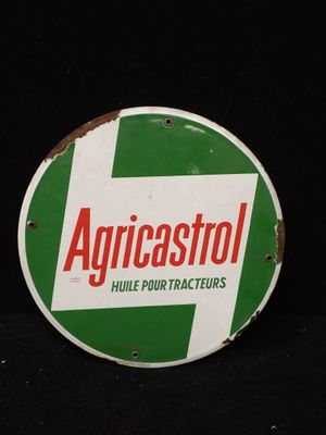un panneau vert et blanc sur lequel est inscrit « Agricostol »