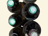 bottles of wine are stacked on top of each other in a wine rack