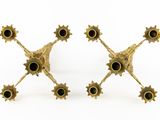 pair of antique brass candlesticks with black glass eyes