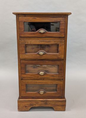 an antique wooden chest of drawers with glass doors and drawers