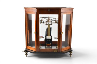 a clock that is sitting inside of a glass case