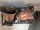 two pots and a cup on a tray on the floor