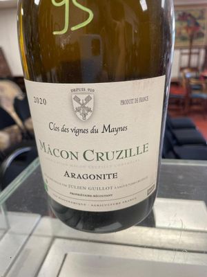 a bottle of wine that is sitting on a table