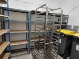 a room with shelves and bins in the middle of it
