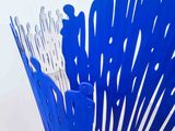 a blue chair that has a lot of people in it