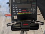 an image of a row of stationary exercise bikes in a gym