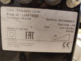 a label on the back of a machine that is sitting on a table