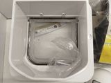 a white toilet and a mouse on a white table