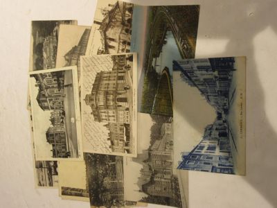a bunch of old postcards that are on the wall