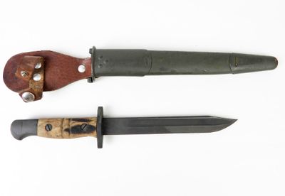 two knives are laying side by side on a white surface