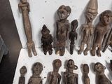 a lot of wooden figurines that are sitting on a table