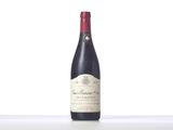 a bottle of wine that is sitting on a table