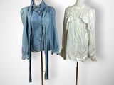 pair of mannequins with jackets and hats on stands