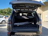 the back end of a car with its trunk open in a parking lot