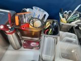a sink with a lot of clutter on it