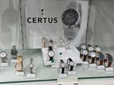 a lot of watches on display in a glass case