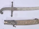 three different types of swords are displayed on a white surface