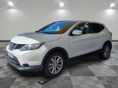 the white nissan suv is parked on a checkered tile floor