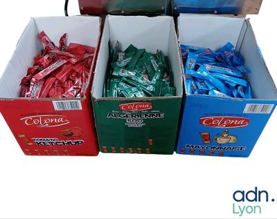 several boxes of candy sitting on top of each other on a table