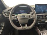 the interior of a car with a steering wheel and dashboard controls