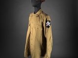 a brown jacket with a star on the chest and a star on the chest