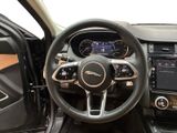 the interior of a car with a steering wheel and dashboard controls