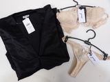 two bras and a pair of panties are on a hanger